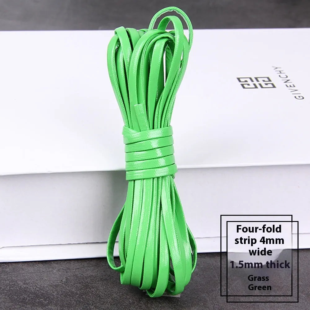 Coils of PU leather craft cord in multiple colours including black, red, blue, and beige