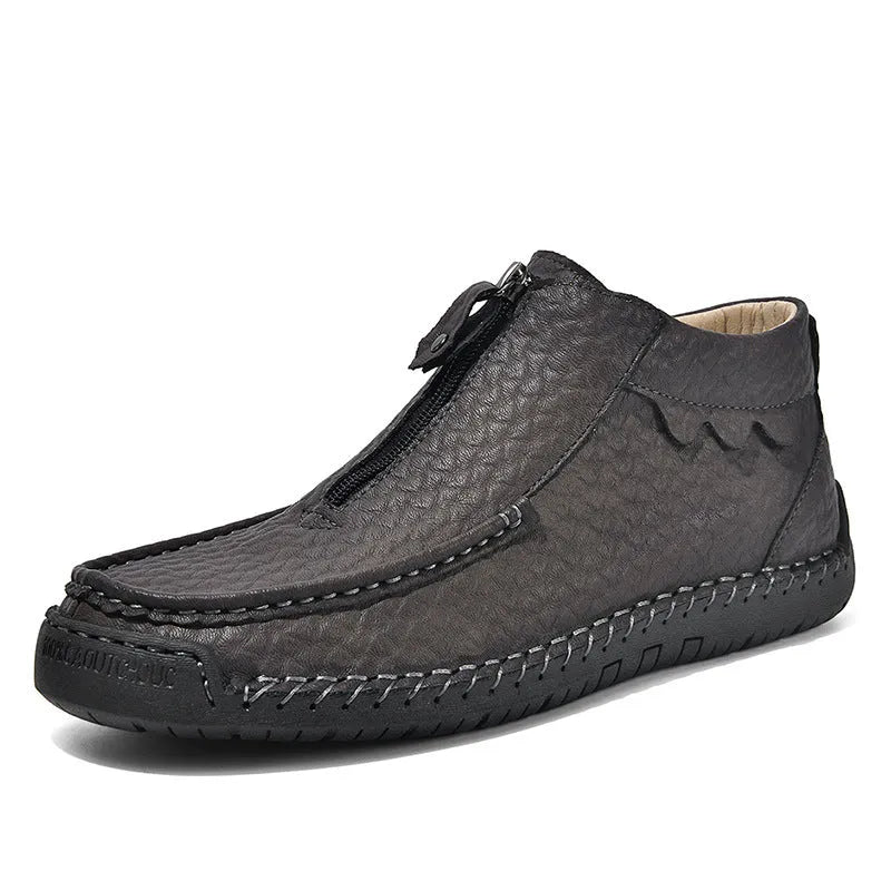 Men's black slip-on leather loafers with a round toe and rubber sole on a white background.
