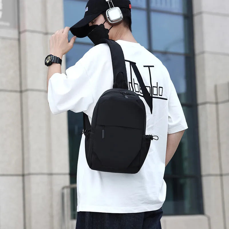 Men's grey lightweight chest bag showing front compartment and adjustable shoulder strap.