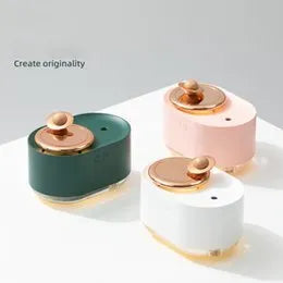 Rotating planet desktop humidifier with night light in green colour showing USB charging port and water tank