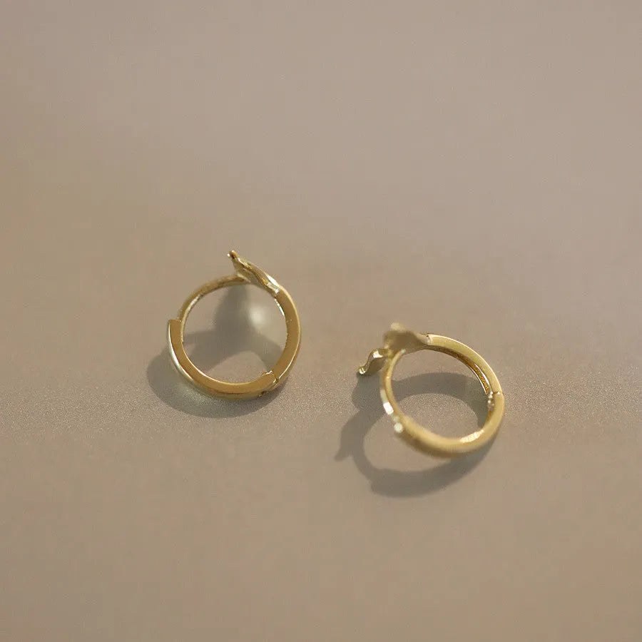 925 sterling silver fishtail earrings with golden plating, approximately 8mm diameter