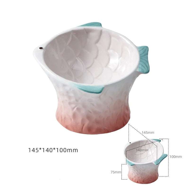 Fish-shaped ceramic cat bowls with 15-degree tilt angle in blue, green, pink, or yellow colours