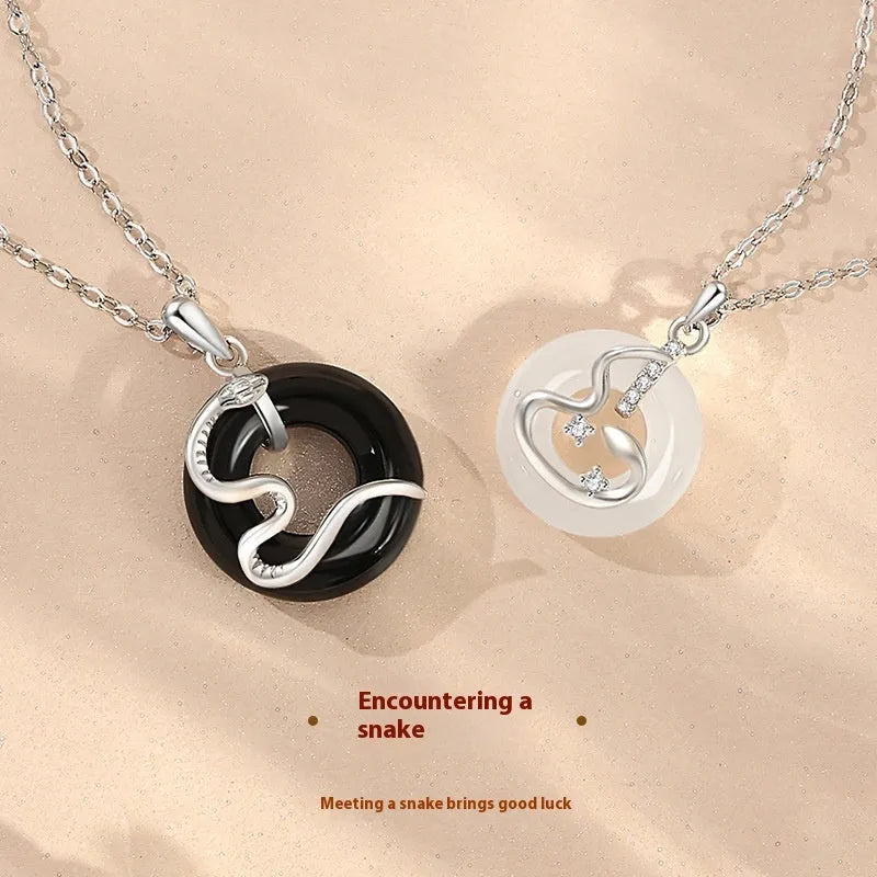 925 sterling silver snake couple necklace with Peace buckle on black background