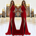 Long red evening dress with a high waist, large swing skirt, hollow detail, and a hanging neckline.