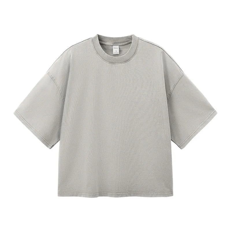 Men's cotton washed-out vintage t-shirt in khaki light showing drop-shoulder sleeve and loose fit