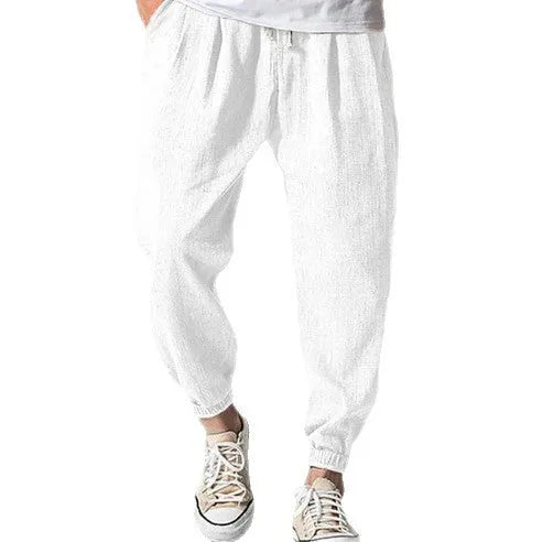 Men's loose casual cotton trousers with an elasticated ankle band in light green.