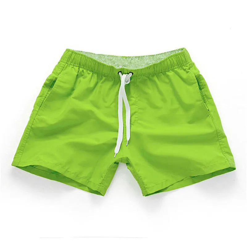 Men's straight-leg beach shorts in polyester fabric shown in a solid colour, laid flat.