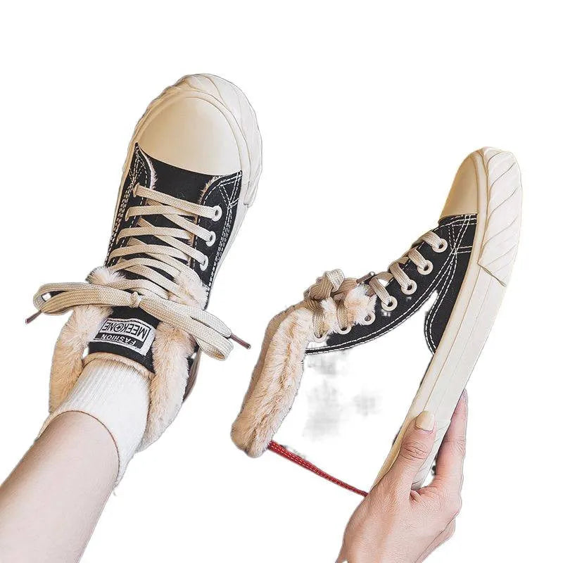 Black women's winter canvas shoes with velvet lining, animal pattern, buckle fastening, low-top rubber sole.