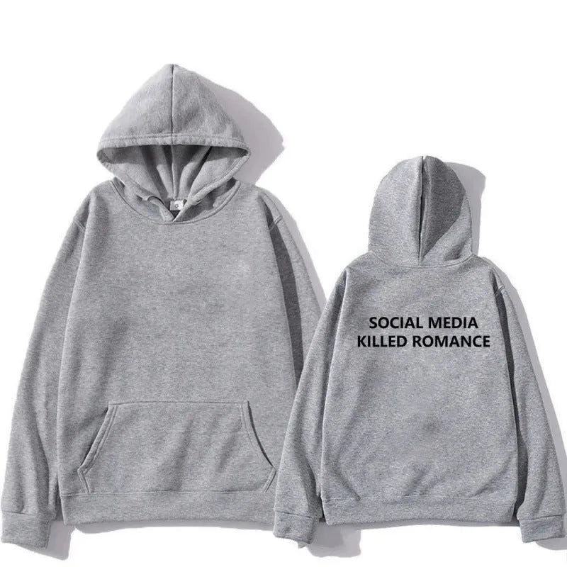 Man wearing a slim fit grey hoodie with a printed white spring letter pattern on the front.