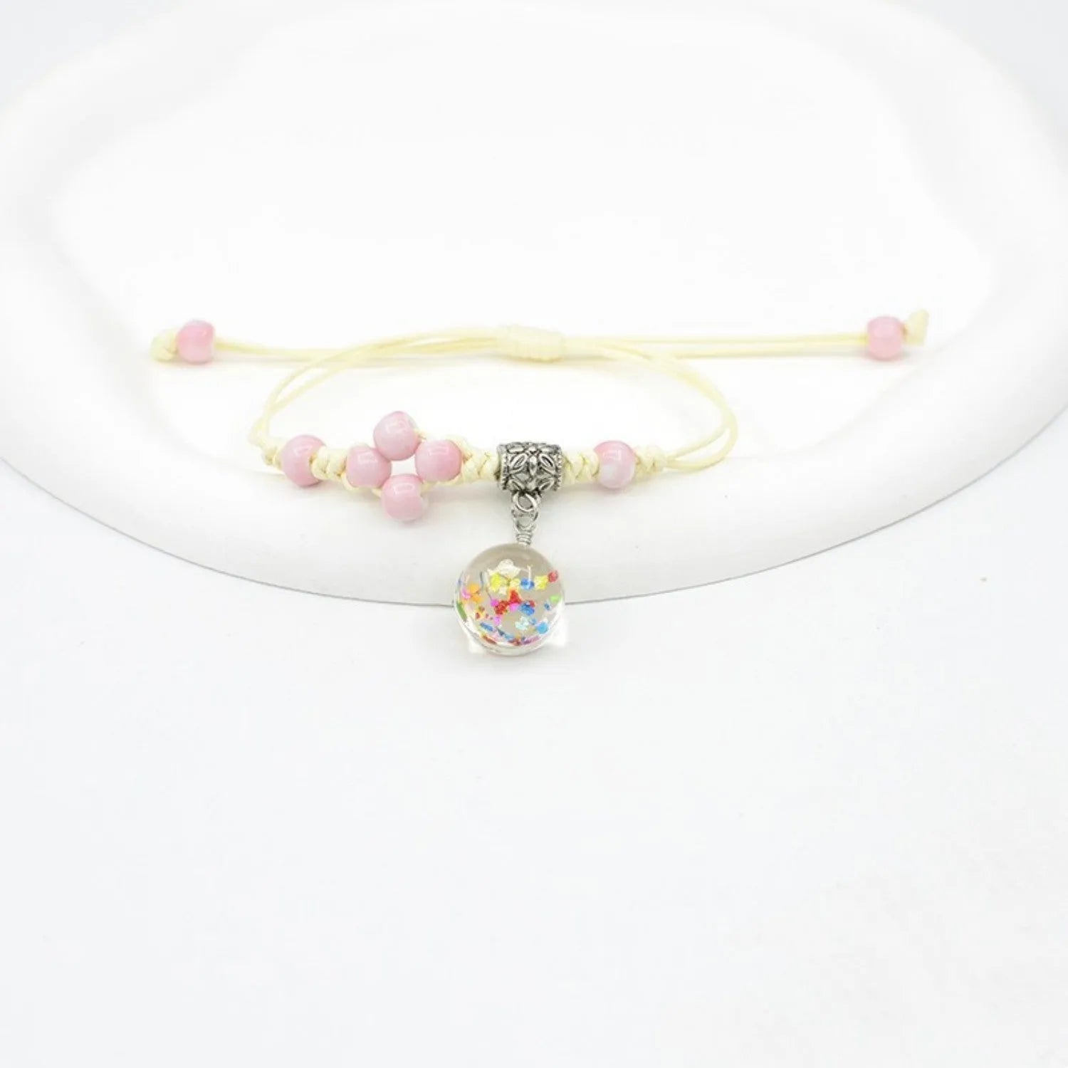 Glass dried flower bracelet with large 1.4 cm beads containing real preserved flowers in hand-woven lace design