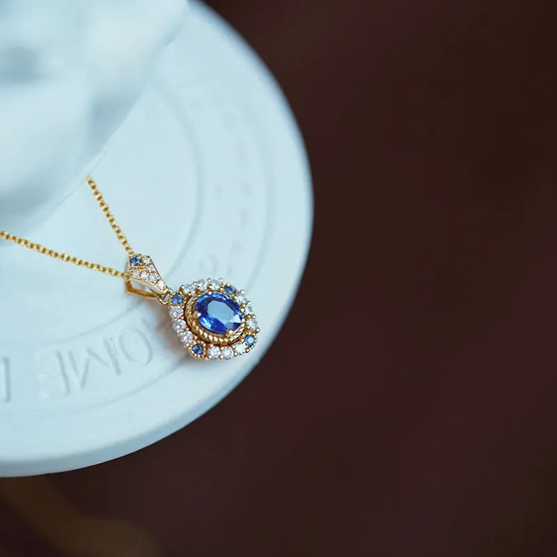 Yellow gold colour royal style necklace with zircon inlaid pendant on an adjustable copper box chain.