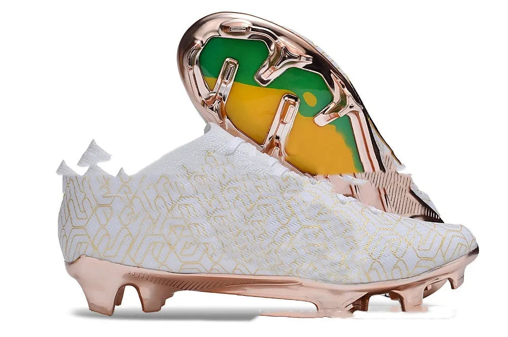 Men's low-top knitted football shoes with white/blue colourway, showing FG studs on rubber outsole and lace-up front.