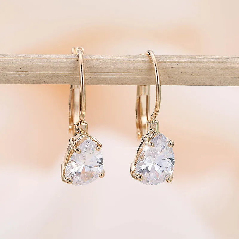 Women's drop-shaped copper earrings in gold or platinum colour finishes