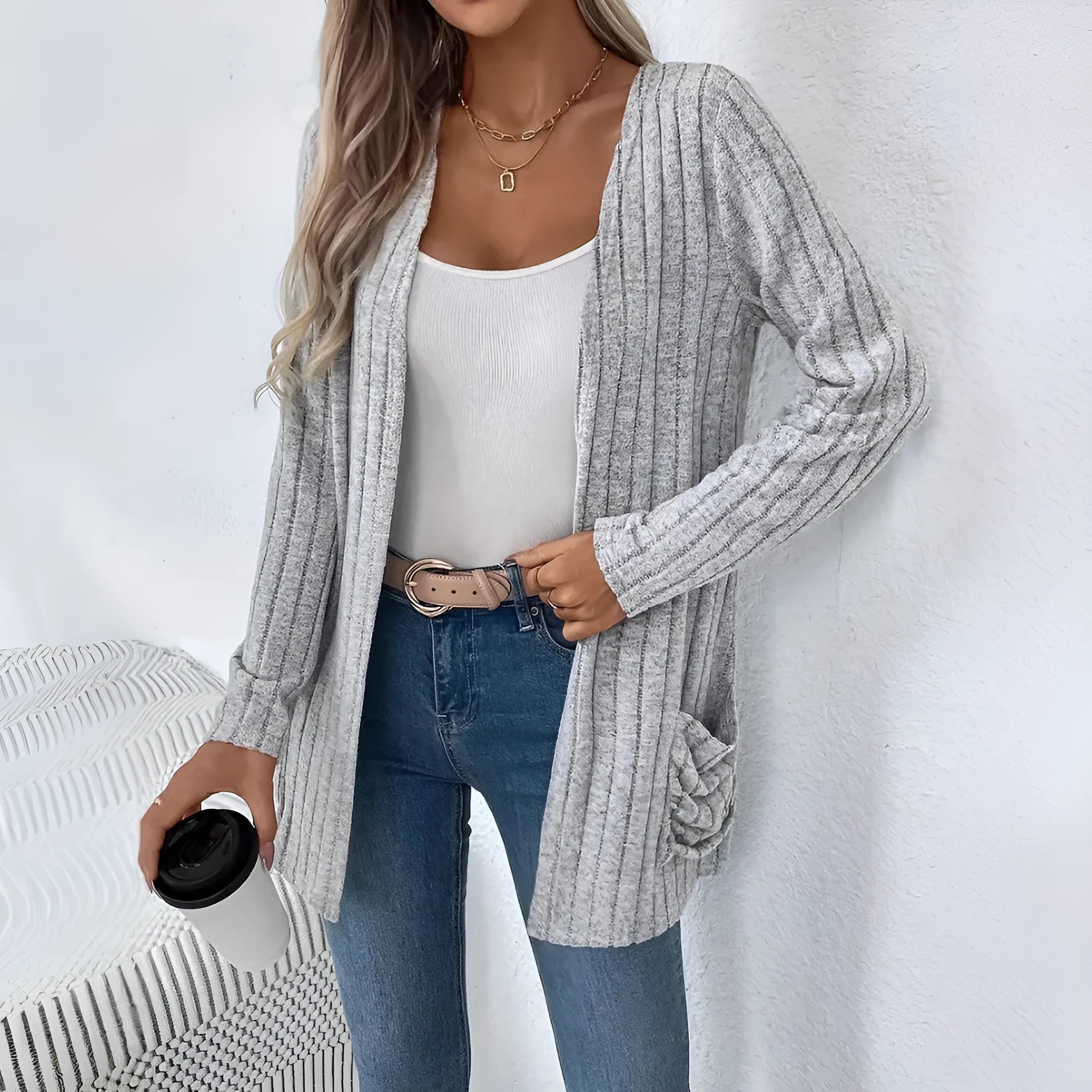 Solid colour long sleeve cardigan with front pockets in a loose fit, shown in grey.