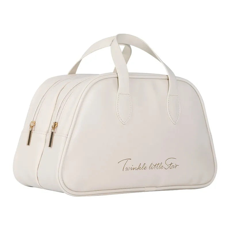 Leather travel toiletry bag in caramel mocha colour with large capacity and dry-wet separation compartments.
