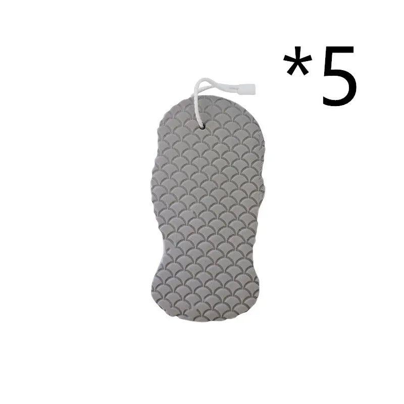 White 3D fish scale pattern bath sponge ball on a bathroom surface