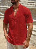 Men's solid colour short-sleeve shirt with a stand collar on a hanger.