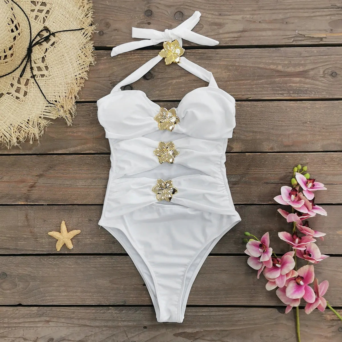 Women's solid colour one-piece swimsuit with a short skirt and hollow-out tube top design.