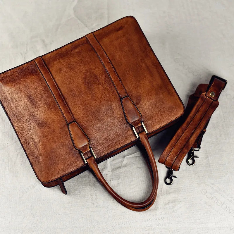 Men's brown leather retro horizontal business handbag with zipper opening.