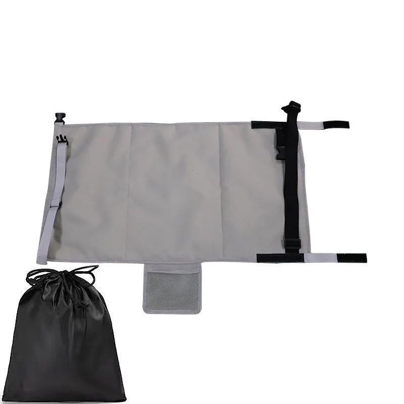 Portable children's aircraft pedal seat extender in blue, black, and grey colours with drawstring storage pocket