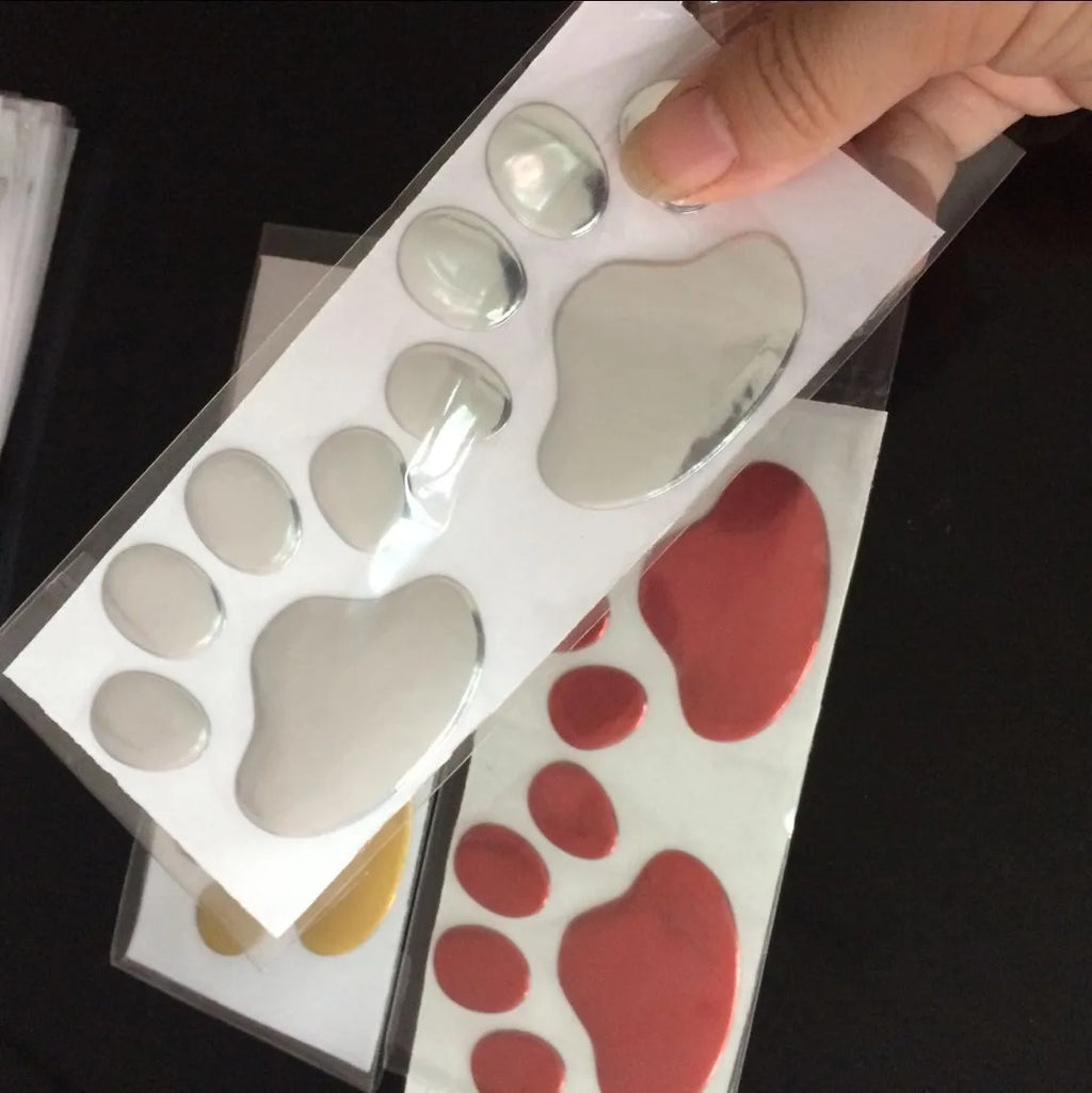 7cm long PVC car sticker with footprint design for bumper application in red, silver, gold or black colours