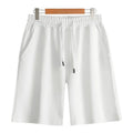 Cotton micro-elastic sports shorts in straight cut fifth length design on hanger