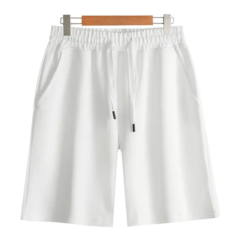 Cotton micro-elastic sports shorts in straight cut fifth length design on hanger