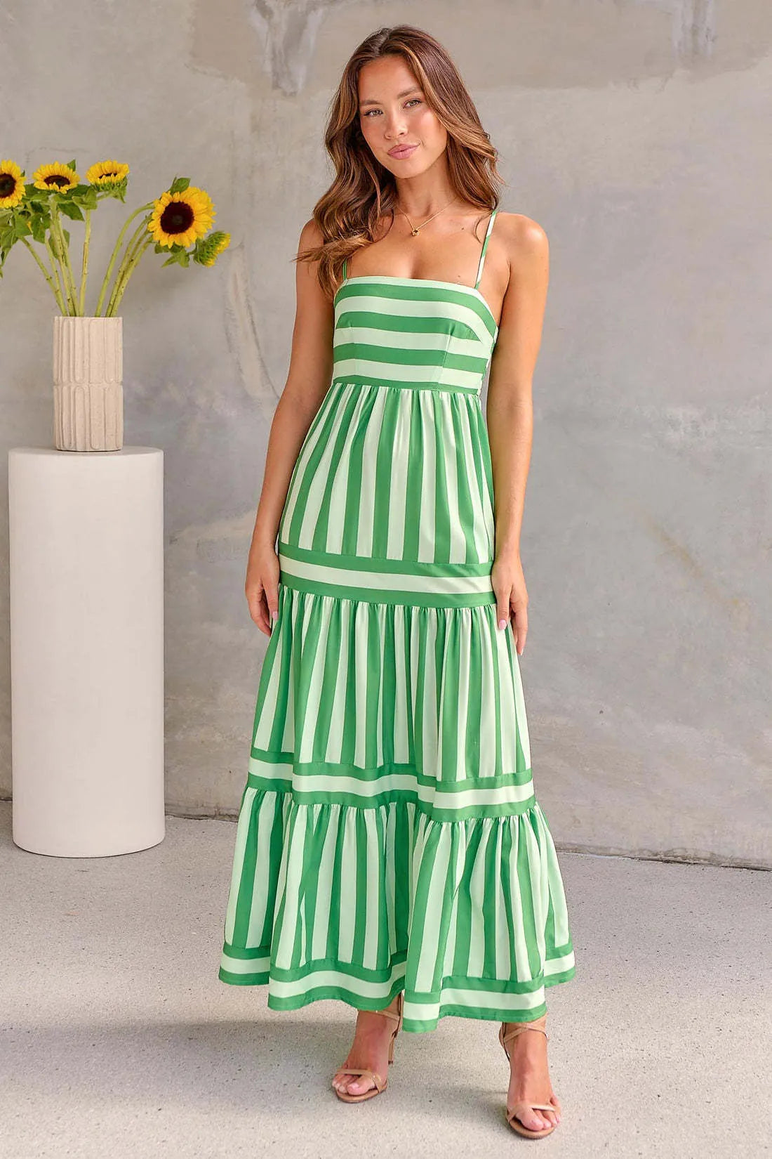Women's striped long summer dress with suspenders, a square neck, backless design, and side pockets.