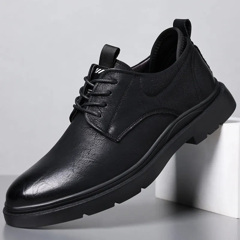 Men's black leather sneakers with decorative sewing lines and rubber sole shown in size 42
