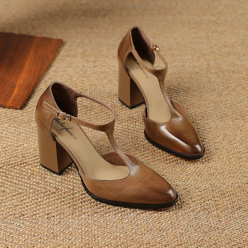 Women's dark brown retro pointed-toe Mary Jane shoes with a buckle fastening on a leather upper.
