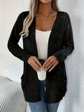 Solid colour long sleeve cardigan with front pockets in a loose fit, shown in grey.