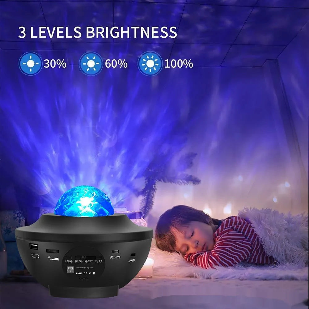 Black parallel style starry sky projection lamp with water ripple laser effects on a desktop.