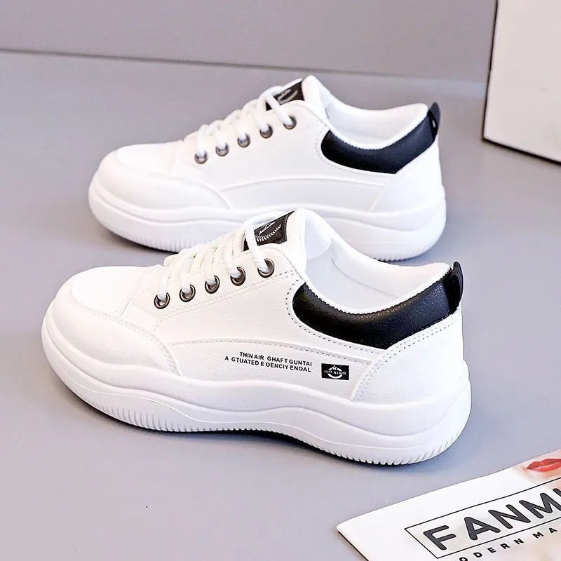 Women's white Korean-style lace-up shoes with cross straps and a mid heel on a rubber sole.