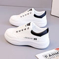 Women's white Korean-style lace-up shoes with cross straps and a mid heel on a rubber sole.