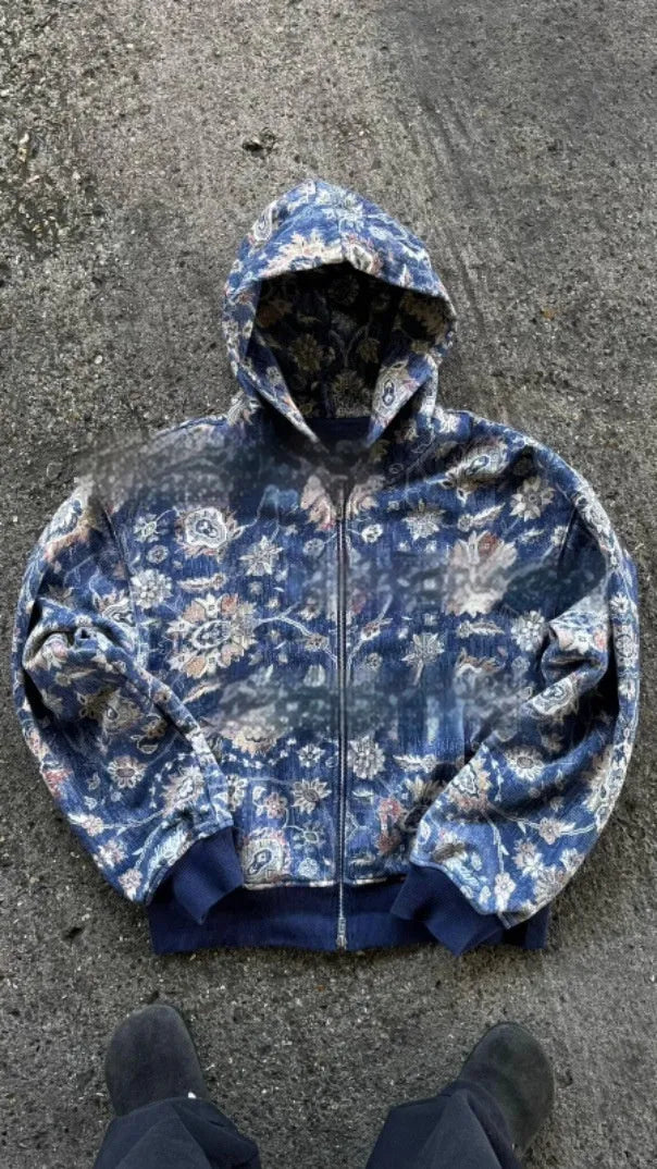 Man wearing a loose-fit blue hooded zip-up polyester coat for casual autumn wear.