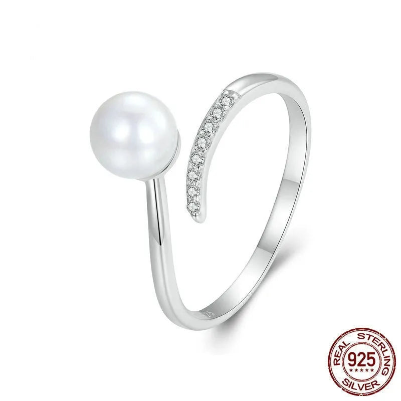 Adjustable S925 sterling silver ring featuring a natural shell pearl on a polished band.