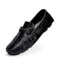 Men's black leather casual shoes with a silver belt buckle and flat rubber sole.