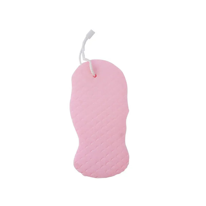 White 3D fish scale pattern bath sponge ball on a bathroom surface