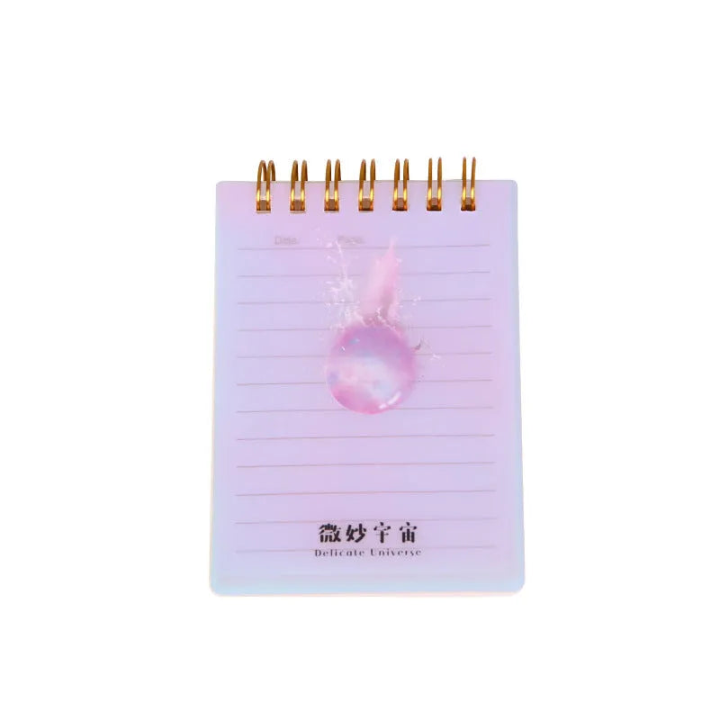Pack of four rollover coil A7 pocket notebooks showing constellation, sakura, ocean, and universe cover designs