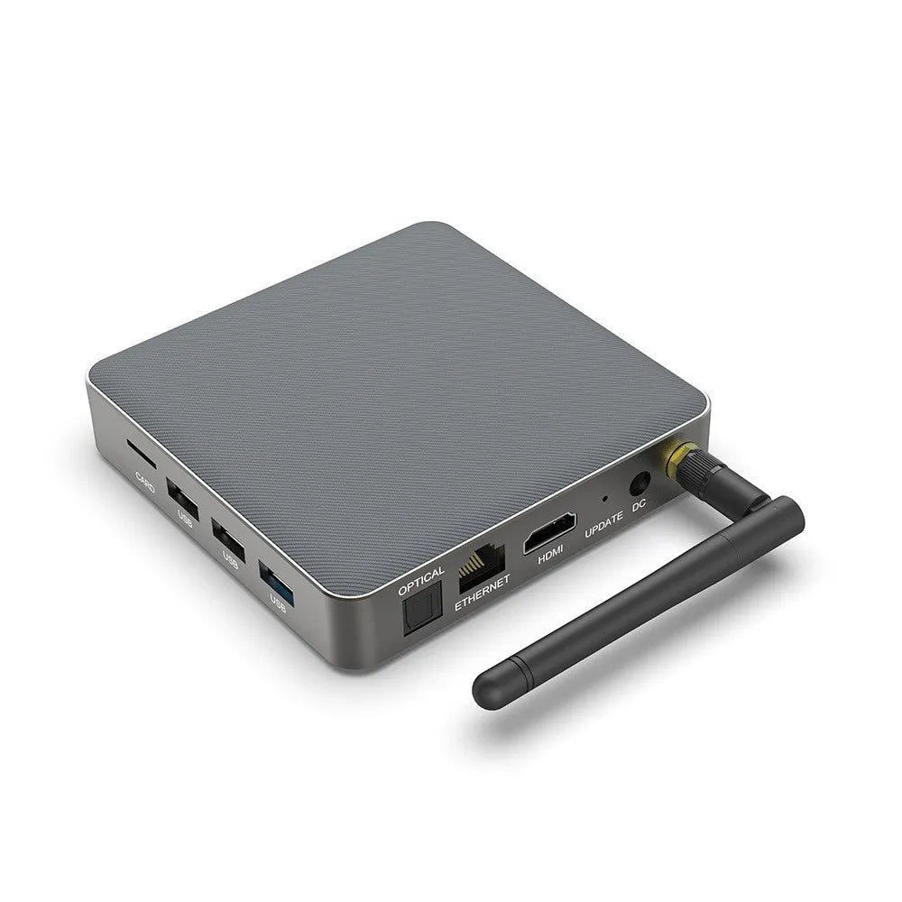 Android TV set-top box with remote control, HDMI cable, and power supply on a white background