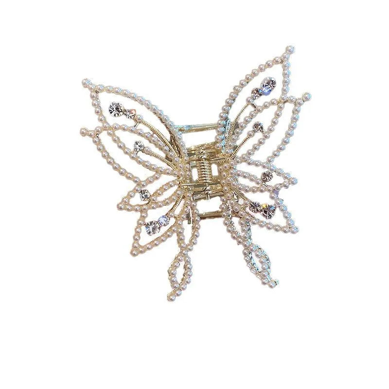 Butterfly-shaped hair clip with pearl or rhinestone decoration on alloy base