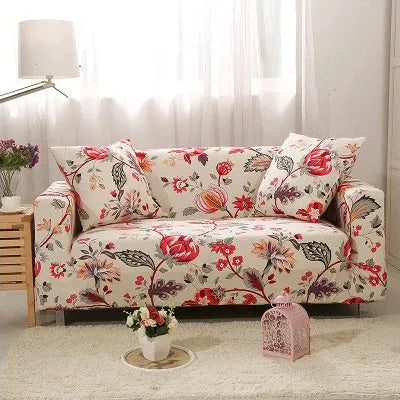 Geometric abstract printed stretch sofa slipcover covering a three-seater sofa with matching cushion covers.