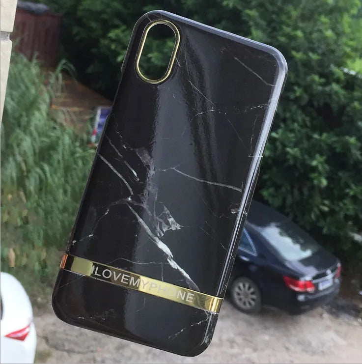Marble pattern plastic case for iPhone on a table, shown in multiple colour options.