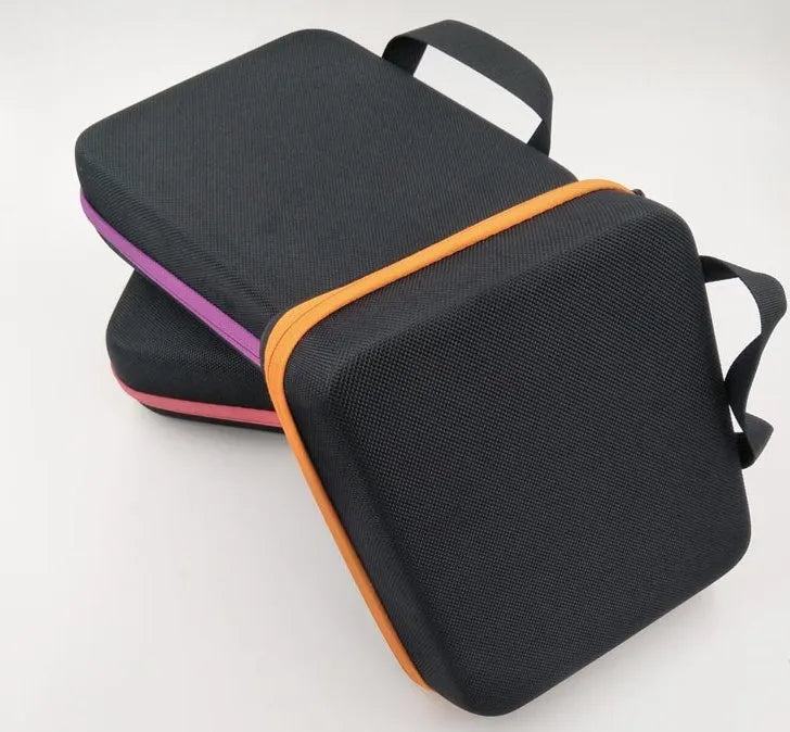 Red EVA cube essential oil storage bag with 30 compartments for 15ml bottles, shown wall-mounted.