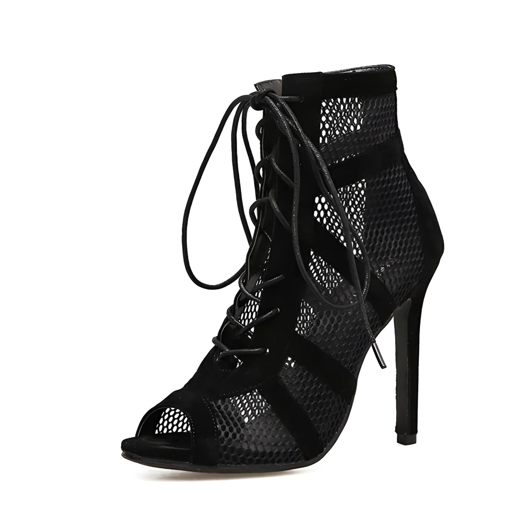 Black suede women's lace-up high heel shoes with a high stiletto heel on a plain background