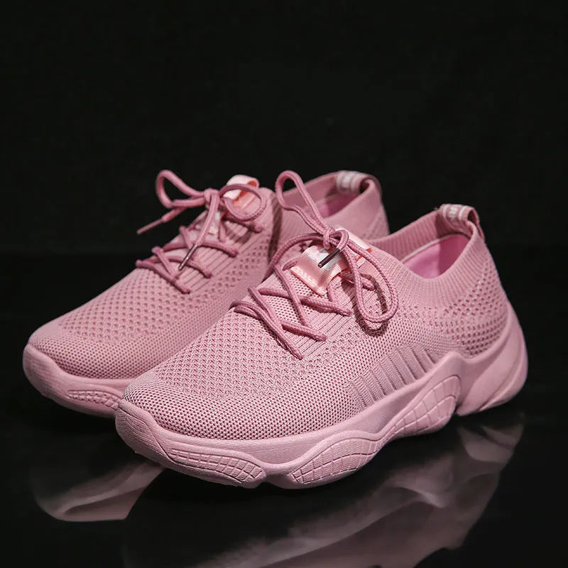 White women's thick-soled flying woven sports shoes with a front strap and rubber sole.