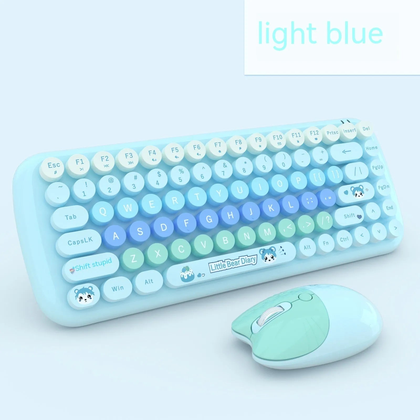 Candy pink wireless keyboard and mouse set on a desk next to a notebook computer.