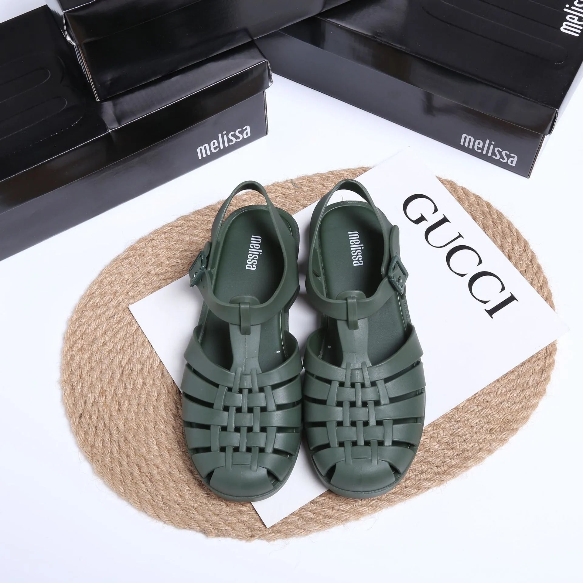 Vintage weave Roman sandals in matte black with buckle closure and round toe