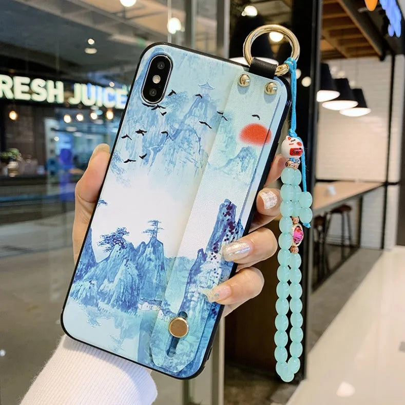 Rose floral patterned phone case with a wrist strap attachment point for iPhone.
