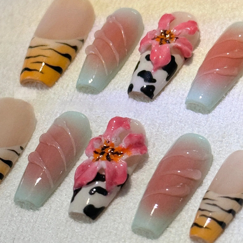 Hand-carved zebra pattern and lily floral nail art set with embossed leopard print.